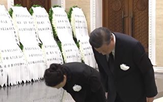 李克强告别式彭丽媛罕见现身 引发猜疑