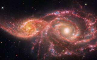NASA两太空望远镜发现：两星系碰撞犹如巨眼