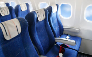 为什么飞机座椅多为蓝色？ 专家释疑